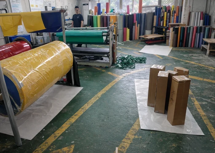 Raw material storage area with organized substrate rolls