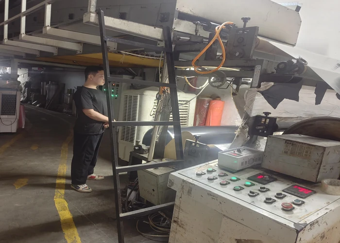 Production workshop interior showing coating equipment and work stations
